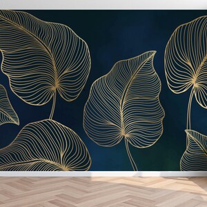 May include: A wall mural featuring large, stylized gold leaves with intricate line details against a dark teal and green watercolor background. The leaves are arranged in a repeating pattern, creating a modern, botanical design.