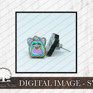 May include: A pair of earrings featuring a purple and blue fuzzy creature with a pink nose and yellow eyes. The earrings are made of wood and have silver posts.