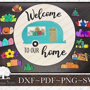 May include: A teal blue camper van with the words "Welcome to our home" in black script. The camper van is surrounded by a variety of colorful shapes, including hearts, stars, pumpkins, and flowers. The background is a black chalkboard with the words "DXF~PDF~PNG~SVG" in white.
