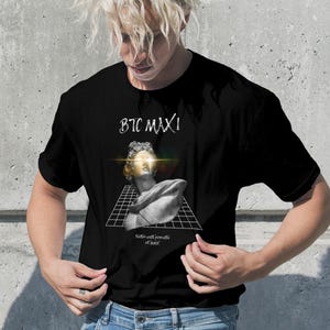 May include: Black t-shirt with a white graphic of a bust sculpture with a grid pattern and the text "BTC MAX!" printed on it. The text "Built with memories of a bull" is printed below the graphic.