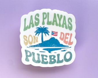 May include: A white sticker with a green, yellow, and pink design. The sticker features a palm tree on an island with a Puerto Rican flag. The text on the sticker reads "Las Playas Son Del Pueblo".