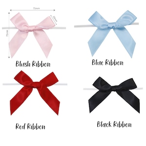 May include: Four satin ribbon bows in different colors: blush, blue, red, and black. Each bow is tied on a white string and measures 7.5 cm wide and 7.5 cm tall.