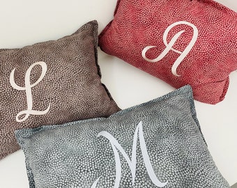 Modern patterned design cushion with embroidered letters