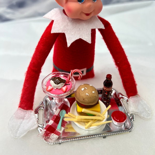 Elf food and drink, elf hamburger tray includes hamburger and fries, ketchup, a bottle of soda, strawberry parfait, napkin and spoon