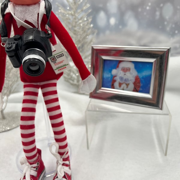 Santa's paparazzi!! Camera with flash, framed and signed photo from Santa and press credentials completes this elf scene!  Elf props