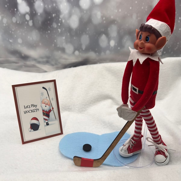 Small elf hockey set with hockey stick, "ice", puck, and sign.  Elf props, elf accessories, elf sports