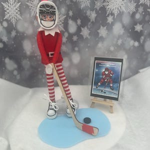 Elf Hockey Prop Set: Miniature Stick, Puck, Felt Ice & Sign