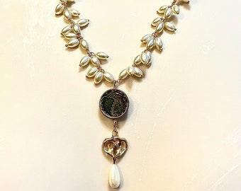 Handmade fresh water pearl, gold, old brass stamping and Vintage bits . leaves repurposed necklace