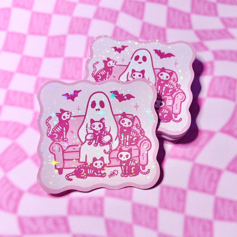 Close-up of ghost surrounded by skeleton cats in holographic finish stickers.