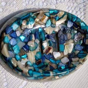 Resin Soap Dish - Handmade oval tray from clear resin and blue, beige, teal, and white shells and rock pieces.