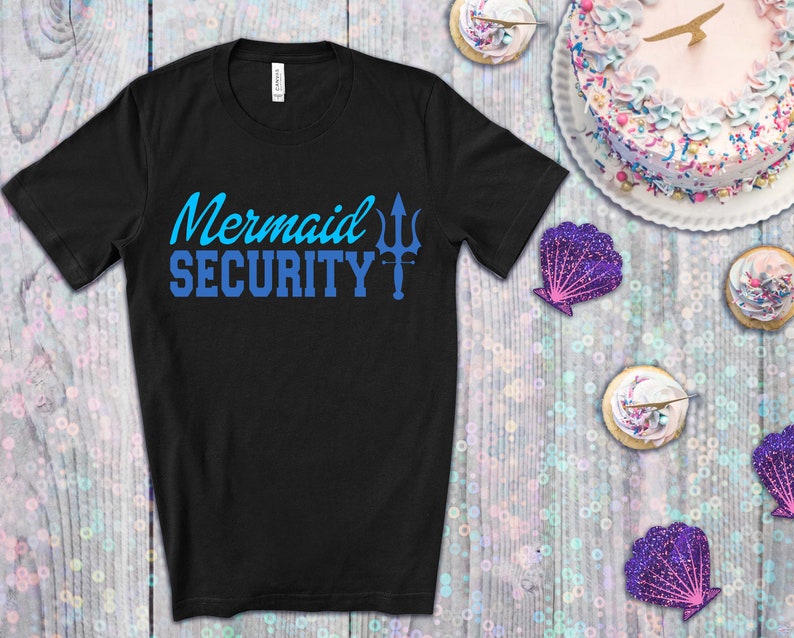 May include: Black t-shirt with blue text that reads "Mermaid Security" and a blue trident graphic.