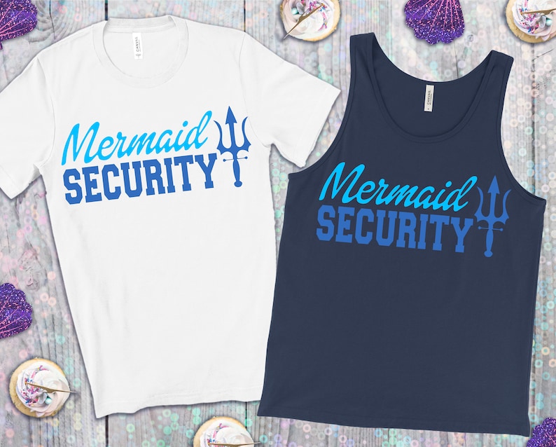 May include: A white t-shirt and a navy blue tank top with the text "Mermaid Security" in blue and a blue trident graphic.