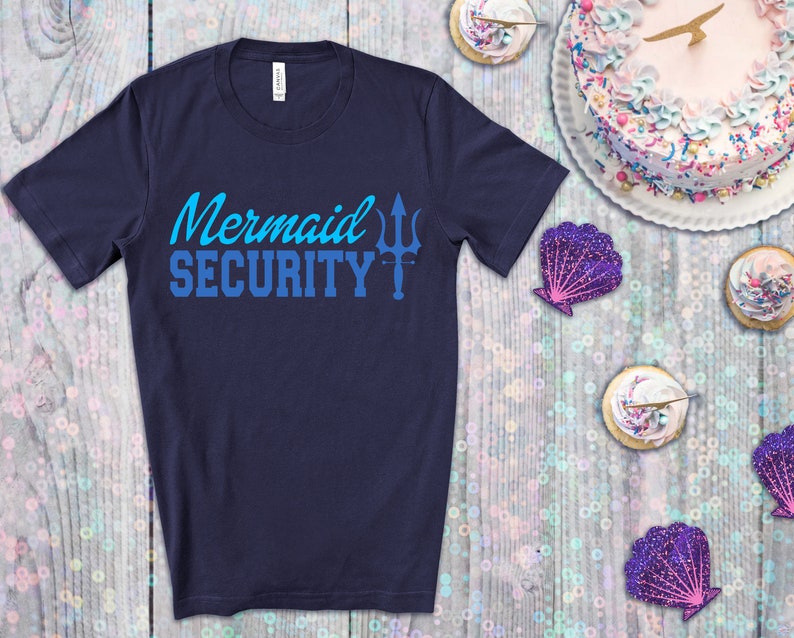 May include: A navy blue t-shirt with the text "Mermaid Security" in blue and a trident symbol.