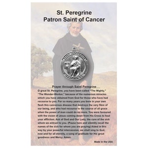 May include: A religious card featuring St. Peregrine, the Patron Saint of Cancer. The image includes a portrait of St. Peregrine, a silver pendant, and a prayer. The text reads "Made in the USA."