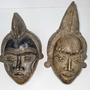 Bronze Heads from Benin, Africa.  They each measure 9H x 10W x 12D inches.