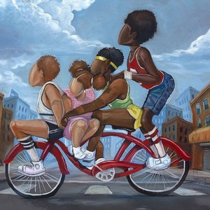 May include: A red bicycle with four people riding it. The people are all looking up at the sky. The bicycle is in front of a city street with buildings on both sides.