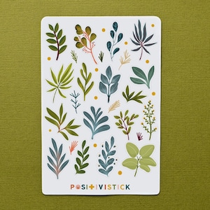 May include: A sheet of stickers featuring various green and blue foliage designs. The stickers are on a white background with yellow dots. The sheet is labeled "Posi+Vistick".