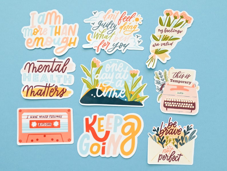 May include: Nine colorful stickers with positive affirmations and illustrations. The stickers feature phrases like "I am more than enough", "Mental Health Matters", "One day at a time", "My feelings are valid", "This is temporary", "Keep going", and "Be brave, not perfect".