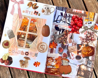 May include: An open scrapbook featuring an autumn moodboard with collaged images of pumpkins, mushrooms, apples, a ghost mug, a window view of fall foliage, and text cutouts including Autumn, Moodboard, Gilmore girls, and dream a little dream of me.