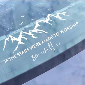 May include: White vinyl decal with a mountain range and birds. The text says "IF THE STARS WERE MADE TO WORSHIP so will i" in a script font. Designed for application on a car window, it has a spiritual theme.