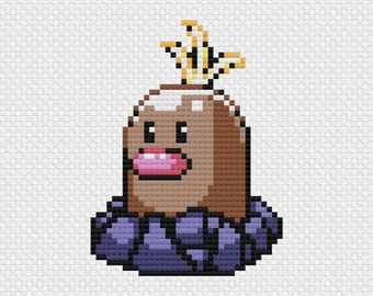 May include: A pixelated cross-stitch design of a cartoon creature. The creature has a brown head with small black eyes, a pink mouth, and a yellow and gold crown. It is set on a white background and has a purple base.