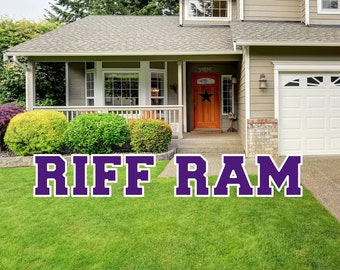 May include: A purple and white "RIFF RAM" yard sign in front of a house with a brown door and a white garage door.