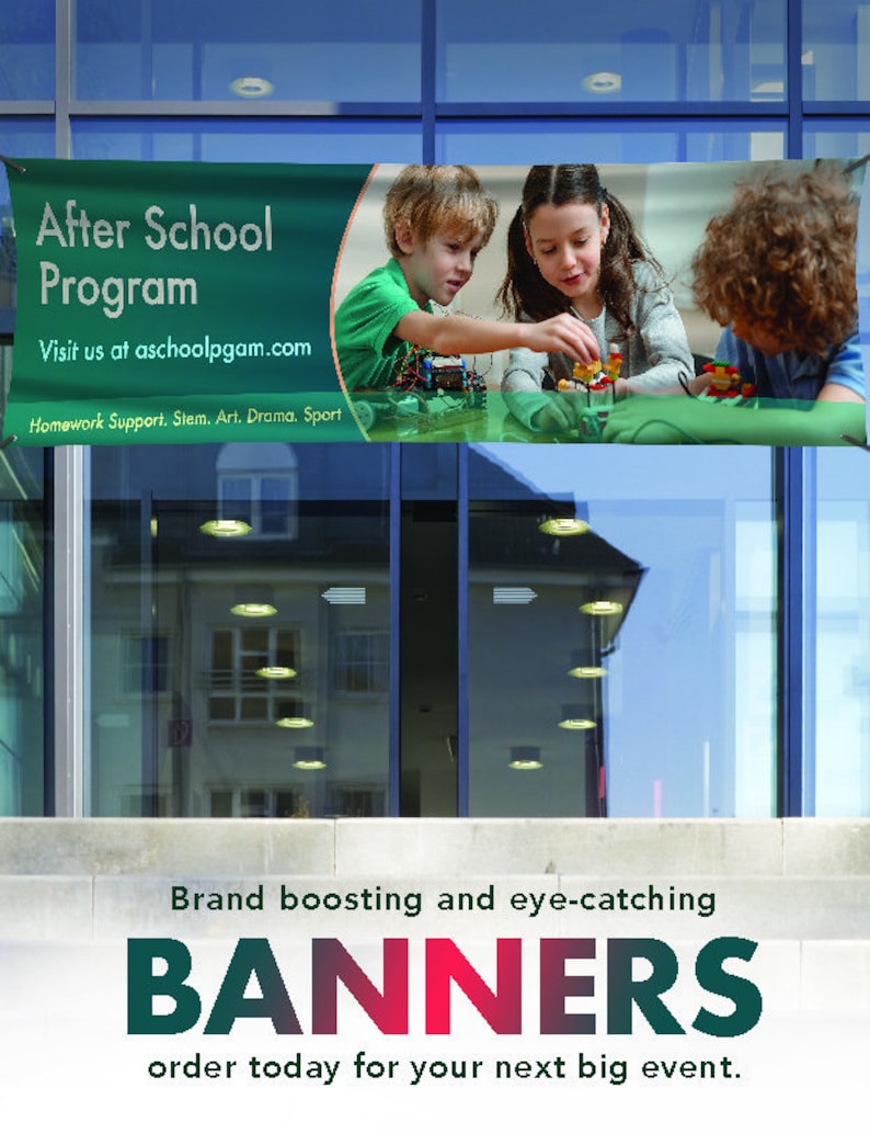 May include: A green banner with white text that reads "After School Program" and "Visit us at aschoolpgam.com". The banner also includes the text "Homework Support, Stem, Art, Drama, Sport". The banner is hanging on a glass door with a reflection of a building behind it. The banner features a photo of three children playing with building blocks.