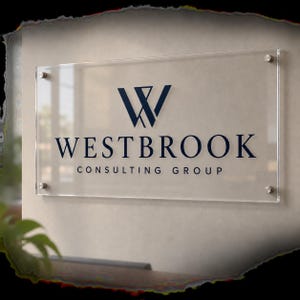 May include: A rectangular clear acrylic sign mounted with four silver metal standoffs. The sign features a dark blue logo consisting of a stylized letter W above the text WESTBROOK CONSULTING GROUP in a clean, professional serif typeface.