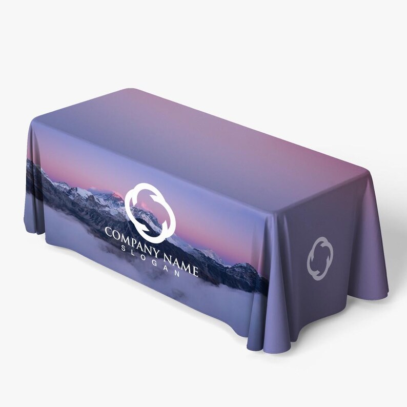 May include: A purple and pink table cover with a mountain scene and a white logo that says "COMPANY NAME SLOGAN".