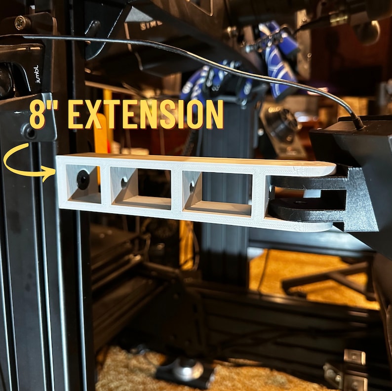 May include: A 3D printed 8" extension for a 3D printer. The extension is gray and has four slots. The extension is attached to a black 3D printer frame.