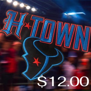 May include: An embroidered patch featuring the text H-TOWN in blue with a red border and a small red star. Below the text is a black bull head logo outlined in blue with a red star on the side. The design uses a bold, athletic font style.