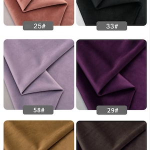 May include: Six fabric swatches in different colors, including pink, black, purple, light purple, brown, and dark brown. Each swatch is folded in half and labeled with a number. The numbers are 25#, 33#, 29#, 58#, 31#, and 32#.