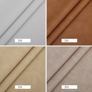 Puede incluir: Cuatro muestras de tela en diferentes colores: gris claro, marr&oacute;n, beige y gris claro con un ligero tono marr&oacute;n. Las muestras est&aacute;n etiquetadas con los n&uacute;meros 26, 28, 29 y 30.