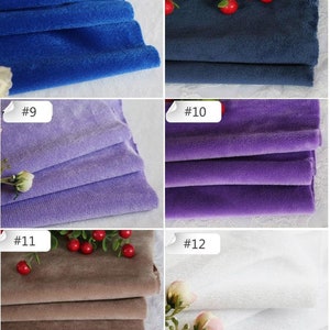 May include: A close-up of six different fabric swatches. The swatches are folded and arranged in a grid pattern. The swatches are in the following colors: blue, navy blue, purple, lavender, brown, and white.