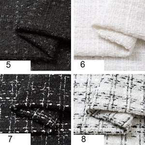 Op de afbeelding: Vier stofstalen, twee zwart en twee wit, met een tweed-achtige textuur. De stalen zijn genummerd 5, 6, 7 en 8.