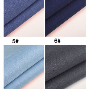 May include: Four fabric swatches in different shades of blue and gray. The swatches are folded in half and arranged in a grid pattern. The swatches are labeled with numbers 5, 6, 7, and 8.