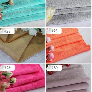 May include: Six fabric swatches in different colors, labeled with numbers 25 through 30. The swatches are folded and arranged in a grid pattern. The colors are turquoise, gray, beige, orange, pink, and purple.