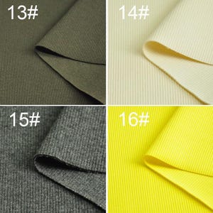 May include: Four fabric swatches in different colors: olive green, cream, gray, and yellow. Each swatch is folded in half and shows the ribbed texture of the fabric.