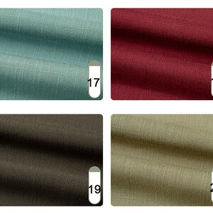 May include: Four fabric swatches in shades of teal, burgundy, dark brown, and olive green. Each swatch has a textured appearance and is labeled with a number. The fabric appears to be linen or a similar woven material, suitable for apparel or home decor.
