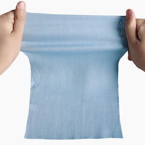 May include: A light blue fabric swatch being stretched out by two hands.