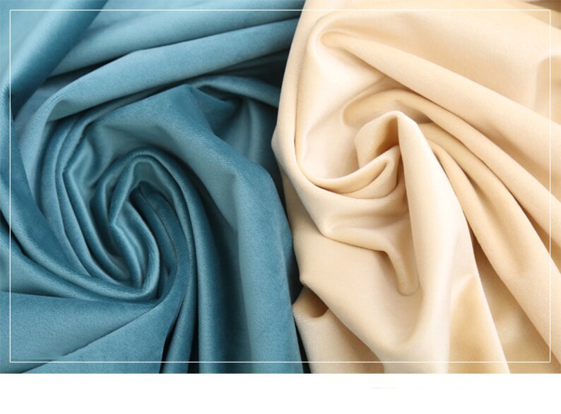 May include: Close-up of two fabric swatches. One is a light blue velvet fabric and the other is a cream colored velvet fabric.