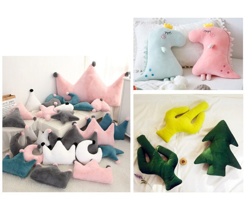 May include: A collection of plush pillows in various shapes and colors, including crowns, stars, moons, cacti, and a Christmas tree. The pillows are made of soft, fuzzy fabric and are perfect for adding a touch of whimsy to any room.