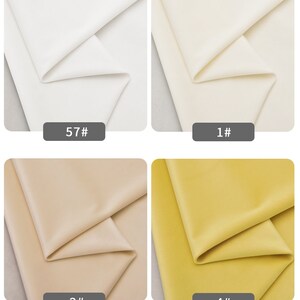 May include: Four fabric swatches in different colors: white, off-white, beige, and yellow. The swatches are labeled with numbers 57, 1, 2, and 4.