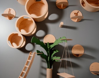 May include: A wooden cat tree with multiple levels, including a ladder, a swing, and a scratching post. The tree is decorated with a green palm tree and several circular platforms.