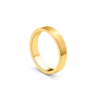 May include: A simple gold wedding band with a smooth, polished finish.
