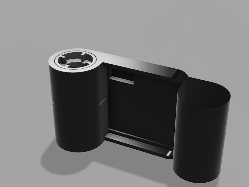 May include: A black film camera with two spools for film. The camera has a rectangular viewfinder and a small button on the side.