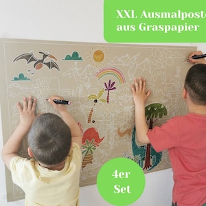 May include: Two children color a large, brown paper dinosaur coloring poster. The poster has a white outline of dinosaurs, trees, and other jungle animals. The poster is labeled "XXL Ausmalposter aus Graspapier 4er Set".