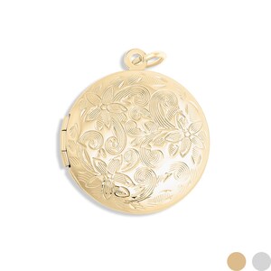 May include: A gold-colored, round locket with a floral design. The locket is closed and has a small loop at the top for a chain. The floral pattern covers the entire surface of the locket.