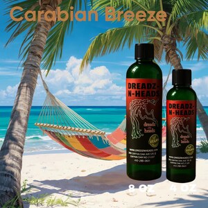 May include: Two green bottles of DREADZ-N-HEADS hair product, one 8 oz and one 4 oz, with a red label and a logo of a woman's silhouette. The bottles are on a beach with a hammock and palm trees. The text "Carabian Breeze" is at the top.