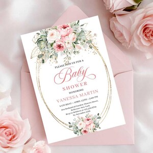 May include: A baby shower invitation with a floral design. The invitation features the text "Baby Shower" and details for Vanessa Martin's shower. The invitation is surrounded by pink roses and placed in a pink envelope.